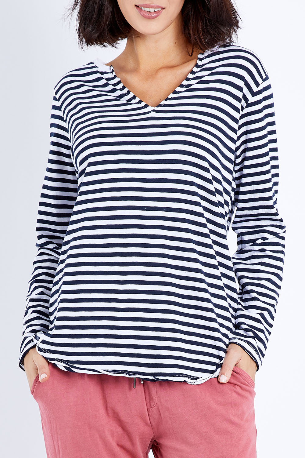 Model Andrea wearing size 10 of the Fundamental Coles Bay Henley in colour Whitenavy (Blue), from the front, cropped image