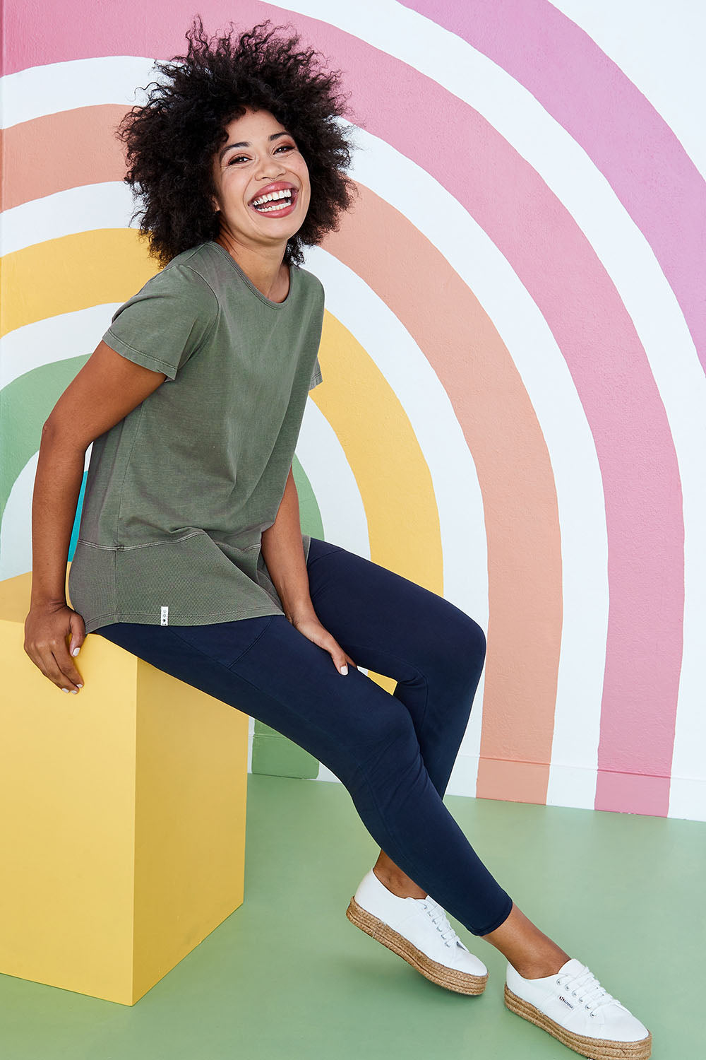 Model Olivia wearing size 10 of the Fundamental Rib Short Sleeve Cotton Tee in colour Khaki (Green), from the front, showing the whole outfit