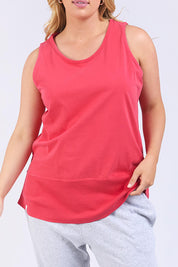 A model wearing the Fundamental Rib Cotton Tank in colour Bitterred (Red), from the front, cropped image