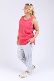 A model wearing the Fundamental Rib Cotton Tank in colour Bitterred (Red), from the front, showing the whole outfit