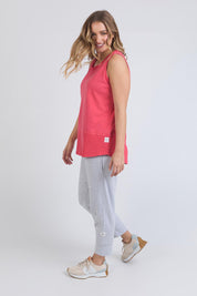 A model wearing the Fundamental Rib Cotton Tank in colour Bitterred (Red), from the front, showing the whole outfit