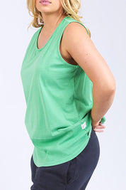 A model wearing the Fundamental Rib Cotton Tank in colour Greenbriar (Green), from the front, cropped image