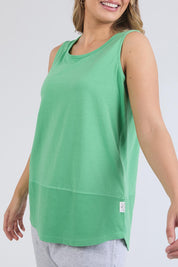 A model wearing the Fundamental Rib Cotton Tank in colour Greenbriar (Green), from the front, cropped image