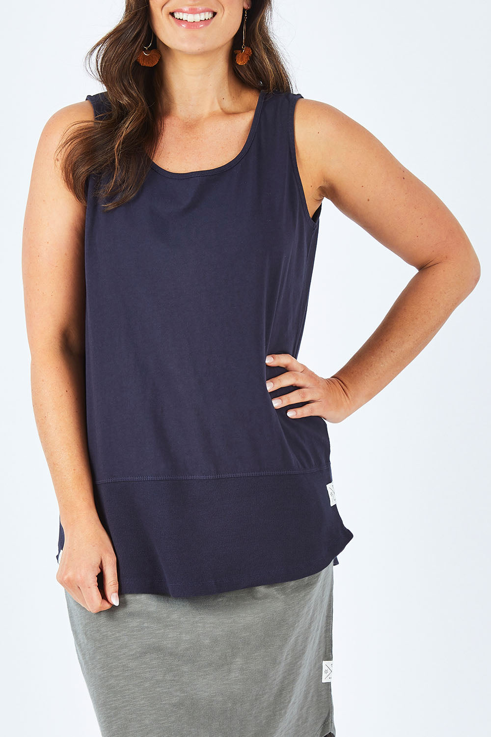 Model Shadae wearing size 10 of the Fundamental Rib Cotton Tank in colour Navy (Blue), from the front, cropped image