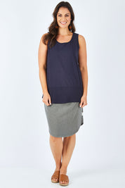 Model Shadae wearing size 10 of the Fundamental Rib Cotton Tank in colour Navy (Blue), from the front, showing the whole outfit