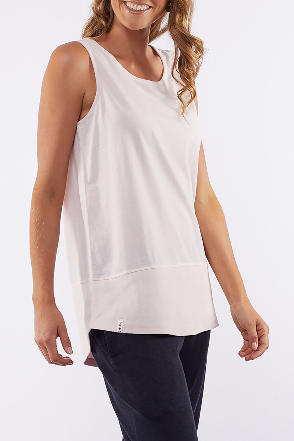 A model wearing the Fundamental Rib Cotton Tank in colour Pink (Pink), from the front, cropped image