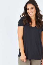 Model Shadae wearing size 10 of the Fundamental Vee Cotton Tee in colour Black (Black), from the front, cropped image