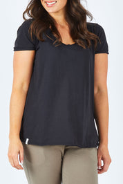 Model Shadae wearing size 10 of the Fundamental Vee Cotton Tee in colour Black (Black), from the front, cropped image