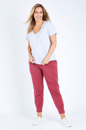 Model Jess wearing size 14 of the Fundamental Vee Cotton Tee in colour GreyMarle (Grey), from the front, showing the whole outfit