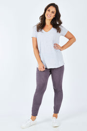 Model Shadae wearing size 10 of the Fundamental Vee Cotton Tee in colour GreyMarle (Grey), from the front, showing the whole outfit