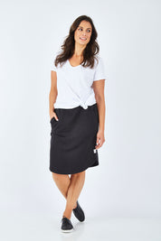 Model Shadae wearing size 10 of the Fundamental Vee Cotton Tee in colour White (White), from the front, showing the whole outfit