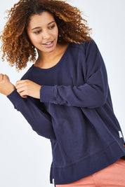 Model Summer wearing size 10 of the Fundamental Sydney Crew in colour Navy (Blue), from the front, cropped image