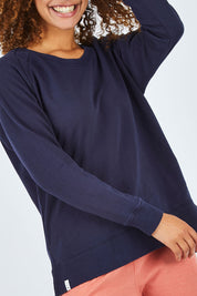 Model Summer wearing size 10 of the Fundamental Sydney Crew in colour Navy (Blue), from the front, cropped image