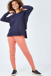 Model Summer wearing size 10 of the Fundamental Sydney Crew in colour Navy (Blue), from the front, showing the whole outfit
