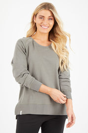 Model Hayley wearing size 10 of the Fundamental Sydney Crew in colour Olivegreen (Green), from the front, cropped image
