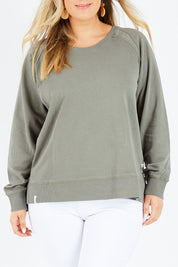 Model Jess wearing size 14 of the Fundamental Sydney Crew in colour Olivegreen (Green), from the front, cropped image