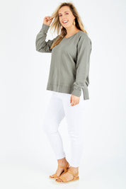 Model Jess wearing size 14 of the Fundamental Sydney Crew in colour Olivegreen (Green), from the front, showing the whole outfit