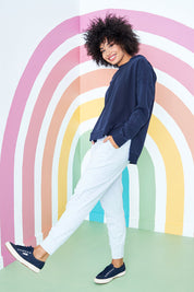 Model Olivia wearing size 10 of the Fundamental Wash Out Pant in colour Greymarle (Grey), from the front, showing the whole outfit