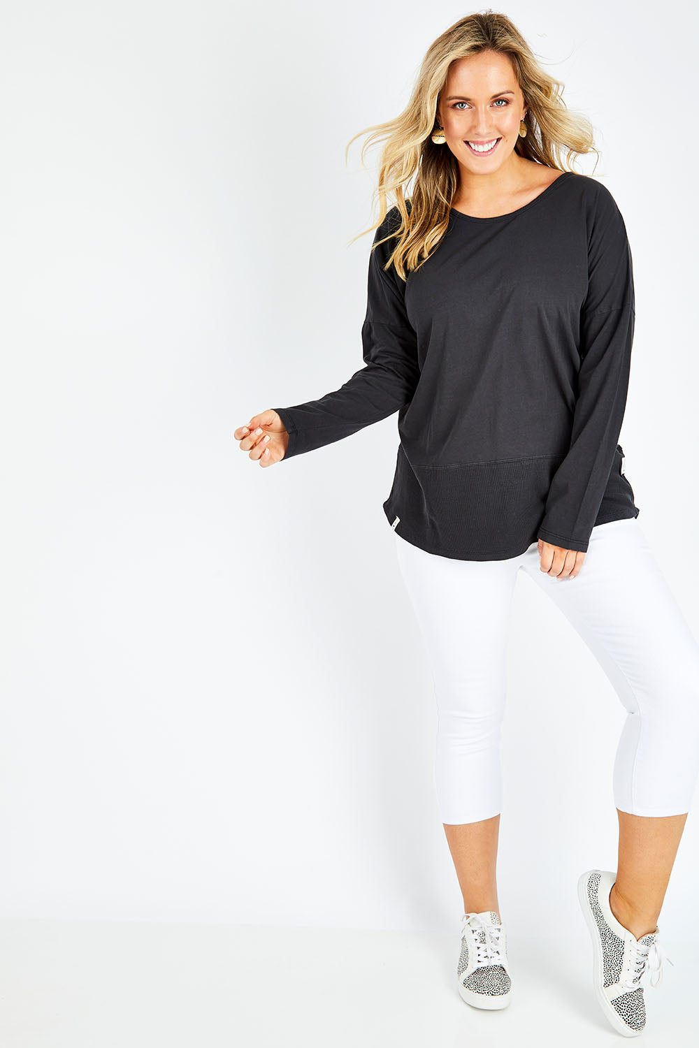 Model Jess wearing size 14 of the Fundamental Rib Long Sleeve Tee in colour Black (Black), from the front, showing the whole outfit