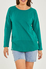 Model Georgia wearing size 10 of the Fundamental Rib Long Sleeve Tee in colour Brightgrn (Green), from the front, cropped image
