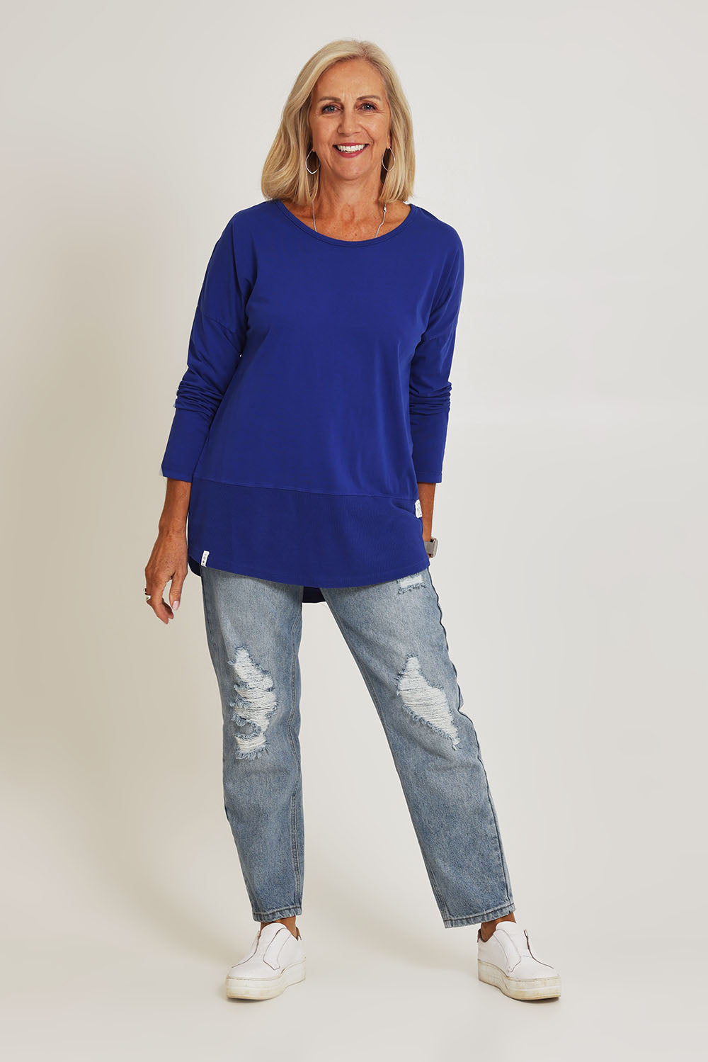 Model Sandy wearing size 10 of the Fundamental Rib Long Sleeve Tee in colour Deepblue (Blue), from the front, showing the whole outfit