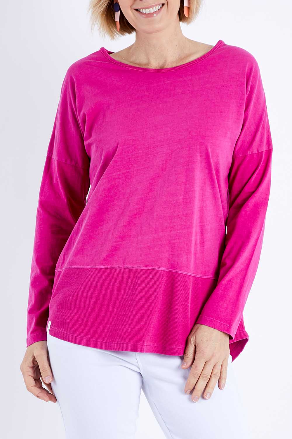 Model Veronica wearing size 10 of the Fundamental Rib Long Sleeve Tee in colour Fuchsia (Pink), from the front, cropped image
