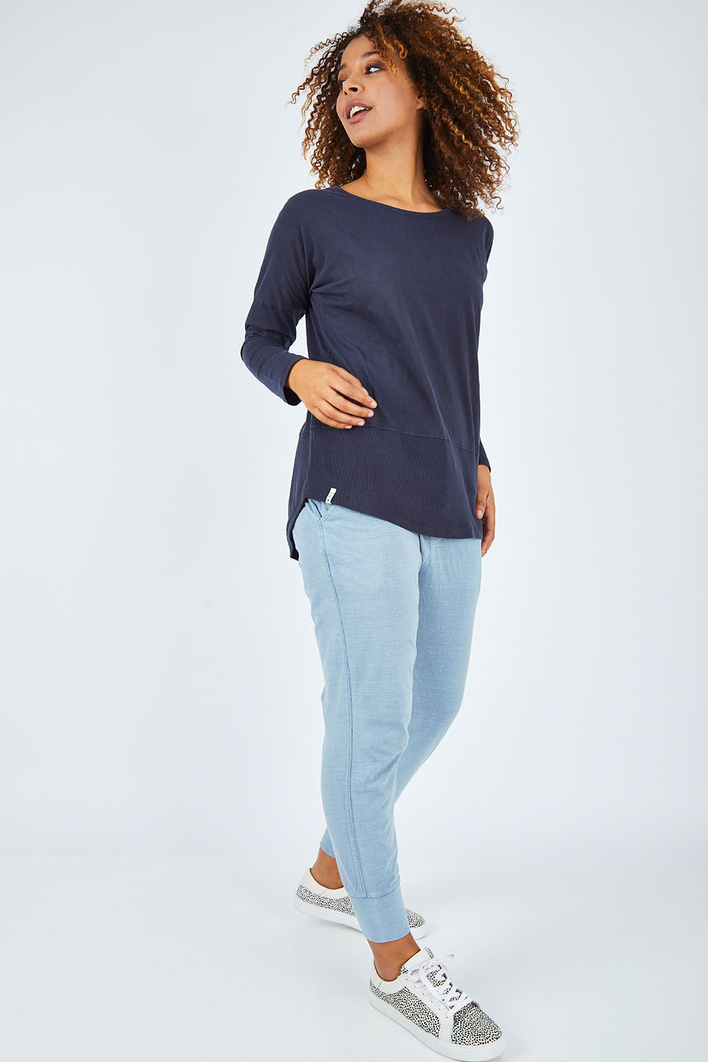 Model Summer wearing size 10 of the Fundamental Rib Long Sleeve Tee in colour Navy (Blue), from the front, showing the whole outfit