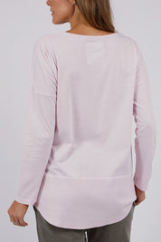 A model wearing the Fundamental Rib Long Sleeve Tee in colour Powderpink (Pink), from the back