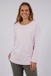 A model wearing the Fundamental Rib Long Sleeve Tee in colour Powderpink (Pink), from the front, cropped image