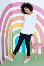 Model Olivia wearing size 10 of the Fundamental Rib Long Sleeve Tee in colour White (White), from the front, showing the whole outfit