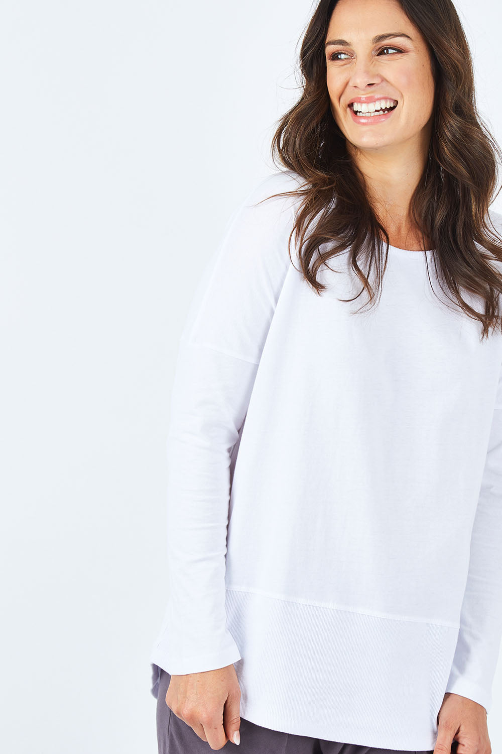 Model Shadae wearing size 10 of the Fundamental Rib Long Sleeve Tee in colour White (White), from the front, cropped image
