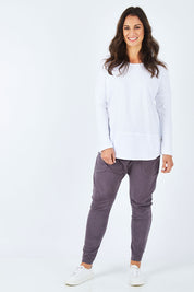 Model Shadae wearing size 10 of the Fundamental Rib Long Sleeve Tee in colour White (White), from the front, showing the whole outfit