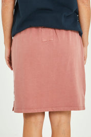 Model Katie wearing size 10 of the Fundamental Cassie Skirt in colour Clay (Pink), from the back