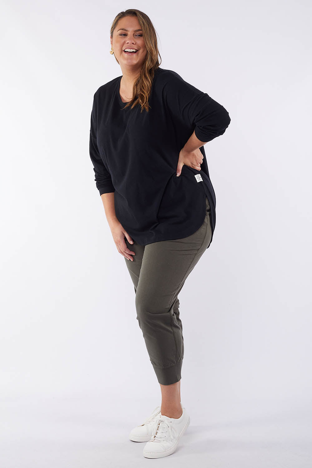 A model wearing the Fundamental Society L/S Tee in colour Black (Black), from the front, showing the whole outfit