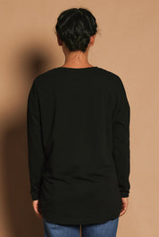 Model Katie wearing size 10 of the Fundamental Society L/S Tee in colour Black (Black), from the back