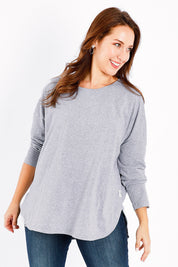 Model Jessica wearing size 14 of the Fundamental Society L/S Tee in colour Greymarle (Grey), from the front, cropped image