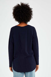 Model Olivia wearing size 10 of the Fundamental Society L/S Tee in colour Navy (Blue), from the back