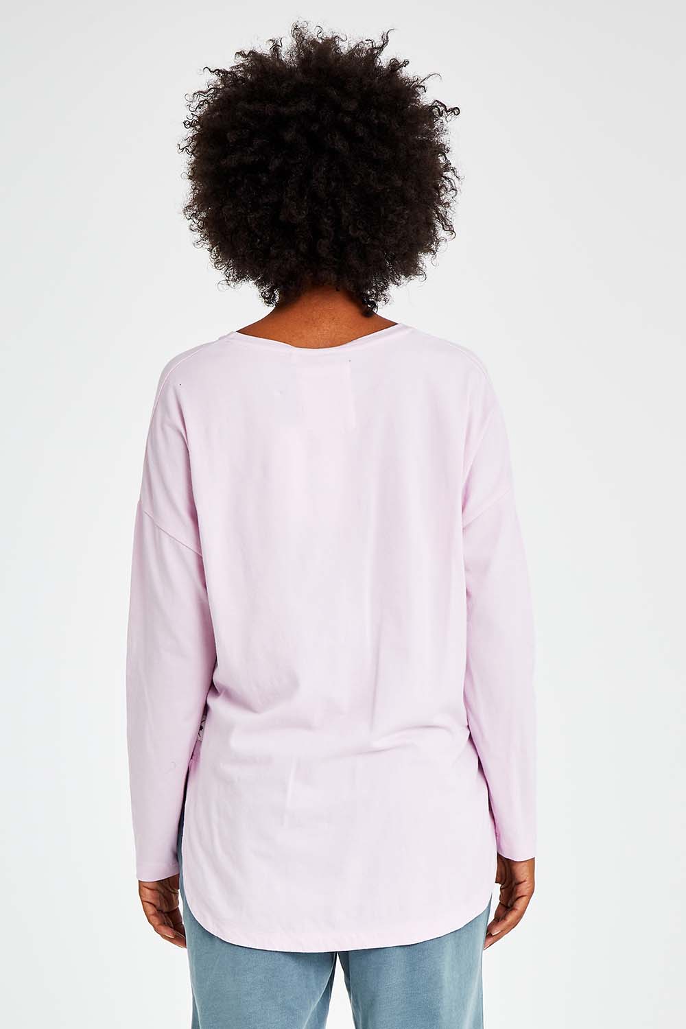 Model Olivia wearing size 10 of the Fundamental Society L/S Tee in colour Pink (Pink), from the back