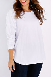 Model Jessica wearing size 14 of the Fundamental Society L/S Tee in colour White (White), from the front, cropped image