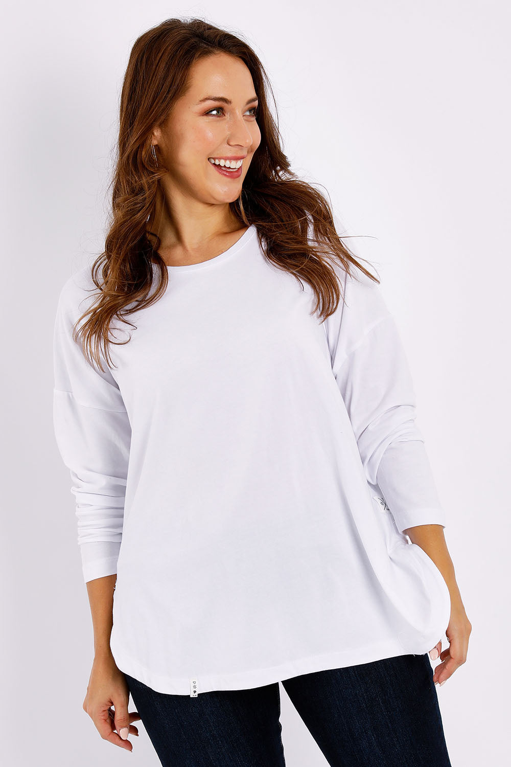 Model Jessica wearing size 14 of the Fundamental Society L/S Tee in colour White (White), from the front, cropped image