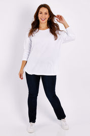 Model Jessica wearing size 14 of the Fundamental Society L/S Tee in colour White (White), from the front, showing the whole outfit