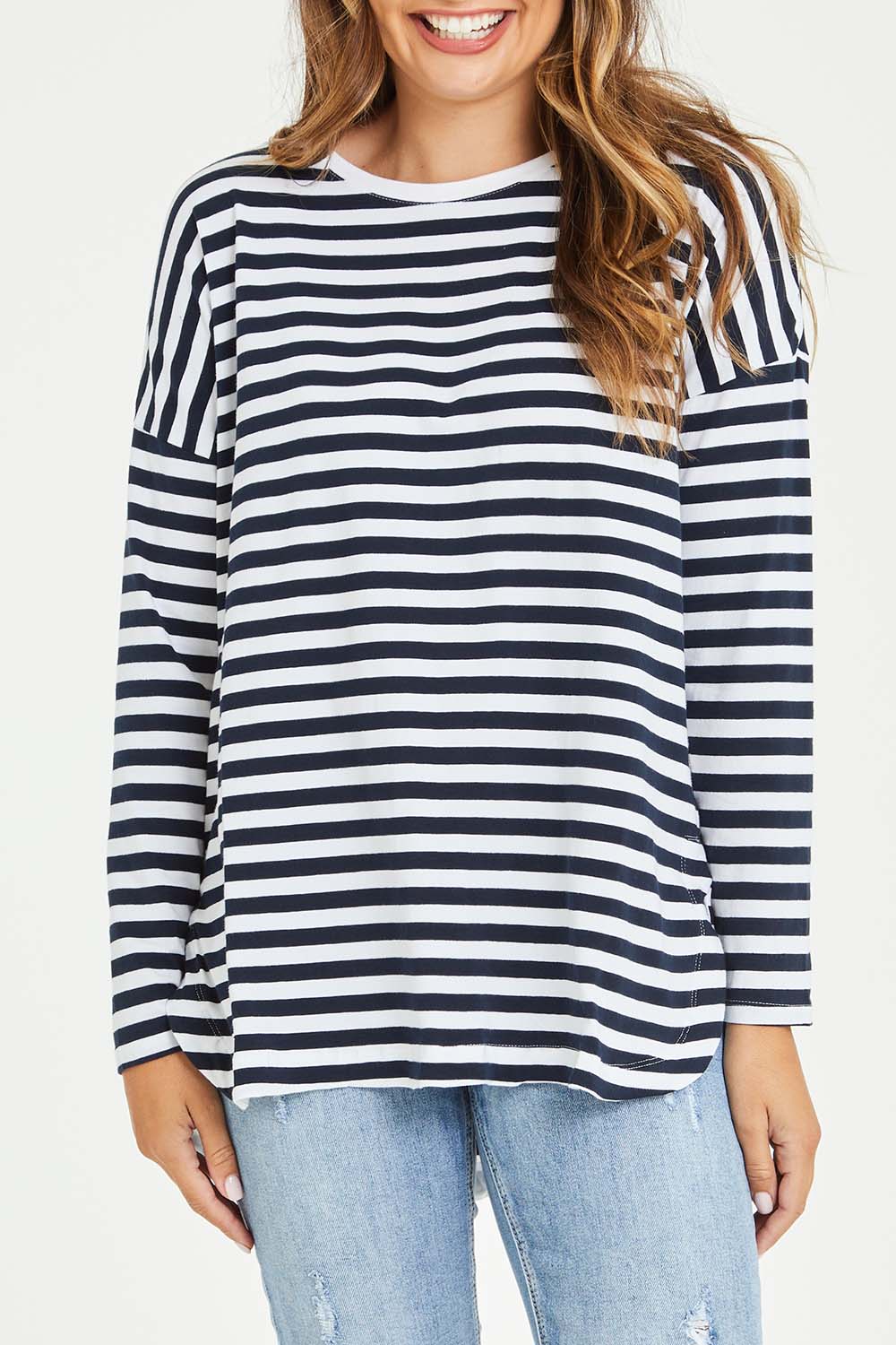 Model Tahlia wearing size 10 of the Fundamental Stripe Society L/S Tee in colour Navywhite (Blue), from the front, cropped image