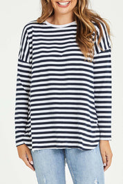 Model Tahlia wearing size 10 of the Fundamental Stripe Society L/S Tee in colour Navywhite (Blue), from the front, cropped image
