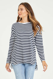 Model Tahlia wearing size 10 of the Fundamental Stripe Society L/S Tee in colour Navywhite (Blue), from the front, cropped image