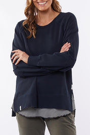 A model wearing the Fundamental Victoria Crew in colour Navy (Blue), from the front, cropped image