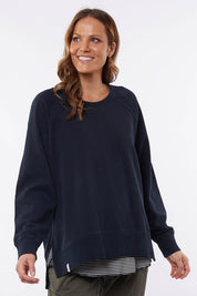 A model wearing the Fundamental Victoria Crew in colour Navy (Blue), from the front, cropped image