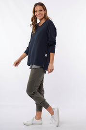 A model wearing the Fundamental Victoria Crew in colour Navy (Blue), from the front, showing the whole outfit