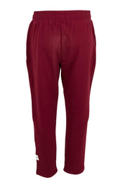 Product shot of the Fundamental Lobby Pant in colour Plum (Purple), from the back