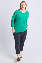 A model wearing the Fundamental Annie 3/4 Sleeve Cotton Tee in colour Turquoise (Green), from the front, showing the whole outfit