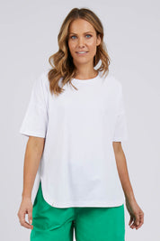 A model wearing the Fundamental Soceity S/S Tee in colour White (White), from the front, cropped image